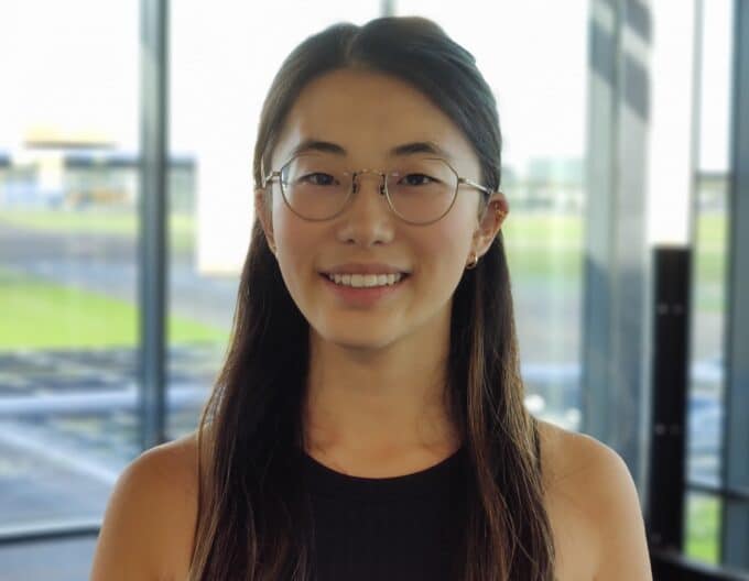 Photo of alum Grace Lin smiling in front of a window.